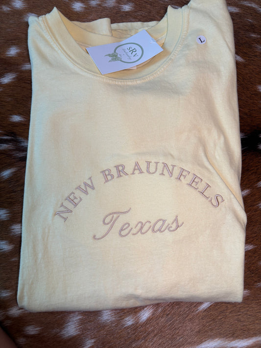 Comfort colors yellow tshirt with “New Braunfels Texas” in pearl thread unisex